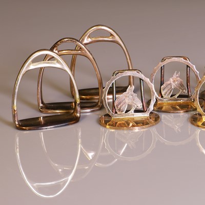 Lot 28 - Of Equestrian Interest: A set of six silver placeholders and six napkin rings