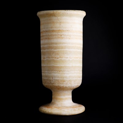 Lot 216 - An Egyptian alabaster vase of cylindrical form
