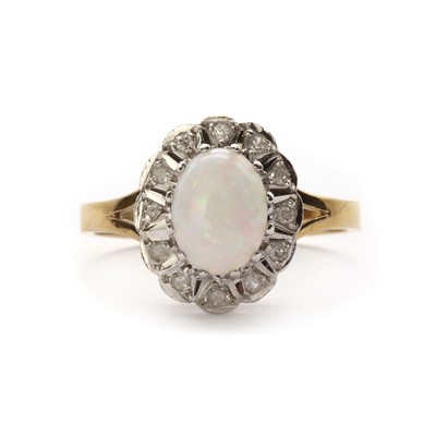 Lot 1321 - A 9ct gold opal and diamond cluster ring