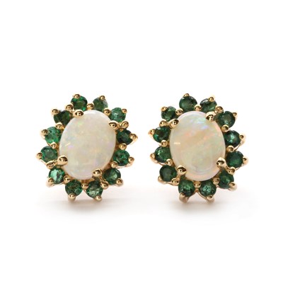 Lot 1318 - A pair of gold opal and emerald cluster earrings