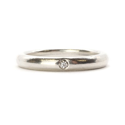 Lot 1284 - A silver single stone diamond band ring, by Tiffany & Co.