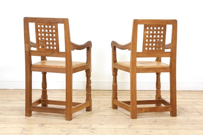 Lot 105 - A pair of Robert 'Mouseman' Thompson oak dining chairs