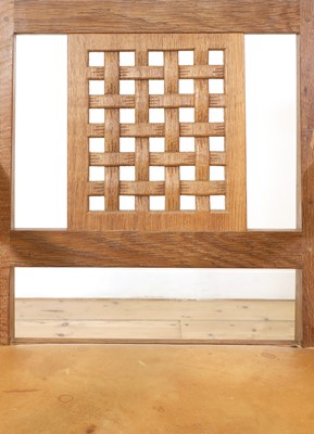 Lot 105 - A pair of Robert 'Mouseman' Thompson oak dining chairs