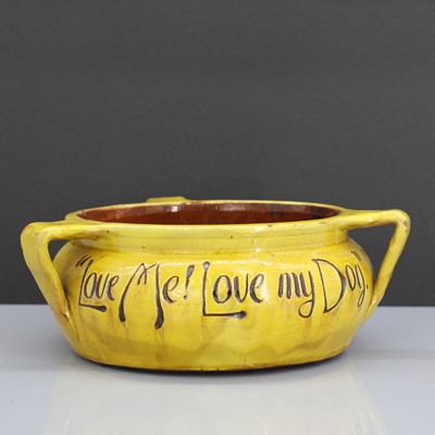Lot 47 - A rare Liberty & Co. yellow pottery dog bowl