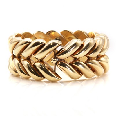 Lot 151 - A 9ct gold plaited effect hollow bracelet, by Kutchinsky, c.1960