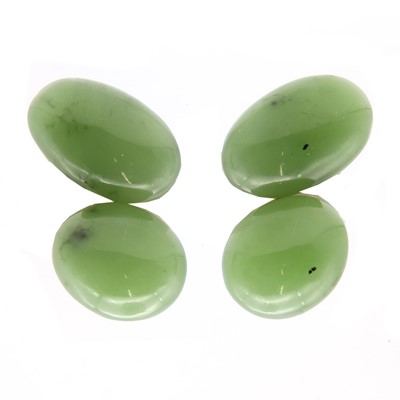 Lot 135 - A pair of French 18ct gold nephrite and jade clip on earrings, designed by Suzanne Belperron