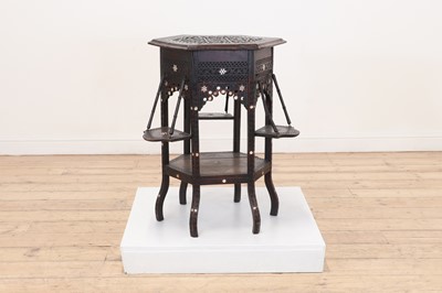 Lot 538 - A carved wooden occasional table