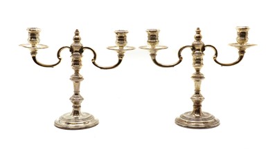 Lot 6 - A pair of silver candelabra