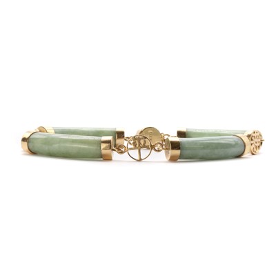 Lot 1240 - A 14ct gold carved jade bar link bracelet