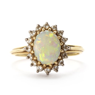 Lot 1317 - A gold opal and diamond cluster ring