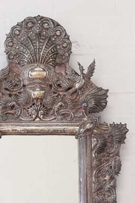 Lot 115 - A repoussé silver mirror