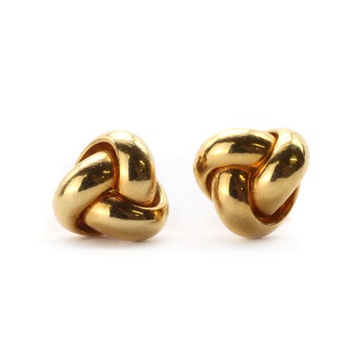 Lot 1353 - A pair of gold knot earrings