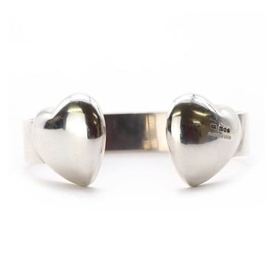 Lot 1289 - A sterling silver torque bangle, by Mappin & Webb