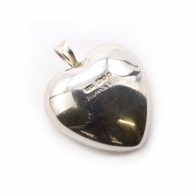 Lot 1288 - A sterling silver solid heart shaped pendant, by Mappin & Webb