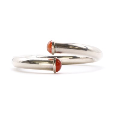 Lot 1248 - A sterling silver cornelian bangle