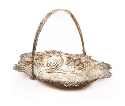 Lot 72 - An Edwardian silver swing handled basket