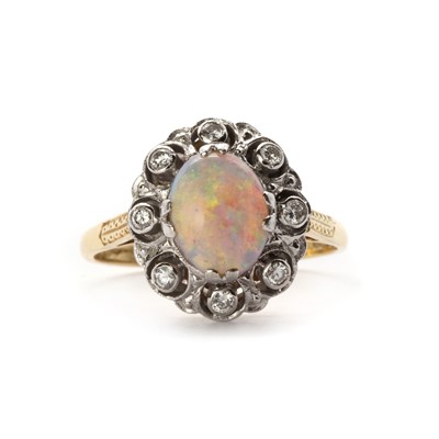 Lot 1319 - An 18ct gold opal and diamond cluster ring