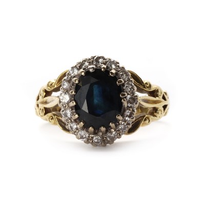 Lot 1281 - An 18ct gold sapphire and diamond cluster ring