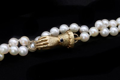 Lot 1344 - A gold sapphire and diamond set hand clasp