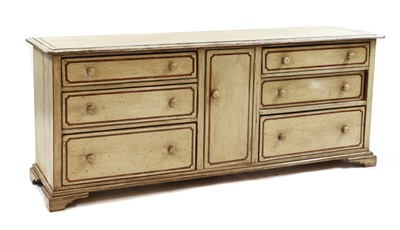 Lot 554 - A large painted chest of drawers