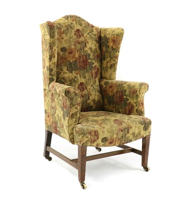 Lot 616 - A wingback armchair