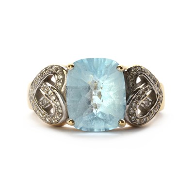 Lot 1259 - A gold blue topaz and diamond ring