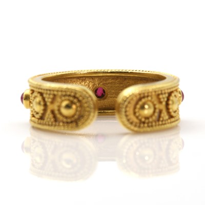 Lot 312 - A gold and ruby Etruscan style torque ring, by Ilias Lalaounis