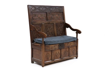 Lot 567 - An oak box-based settle