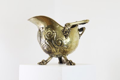 Lot 100 - An embossed brass coal scuttle