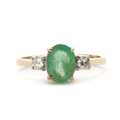 Lot 1235 - A 9ct gold emerald and diamond three stone ring