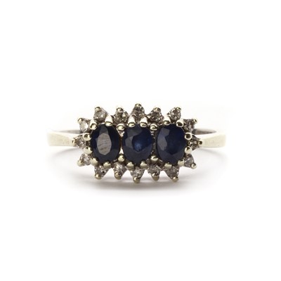 Lot 1269 - A 9ct white gold sapphire and diamond cluster ring