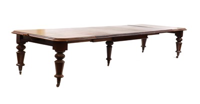 Lot 563 - A large Victorian mahogany wind out extending dining table