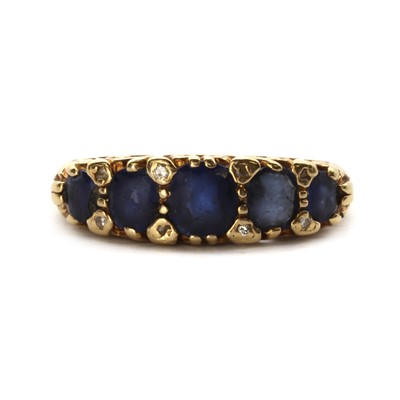 Lot 1276 - An 18ct gold five stone sapphire and diamond ring