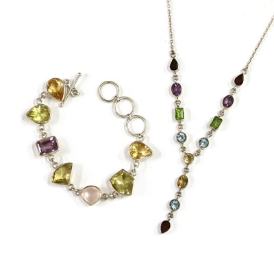 Lot 1210 - A silver citrine, amethyst and rose quartz bracelet