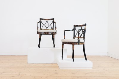 Lot 270 - A pair of Regency-style ebonised elbow chairs