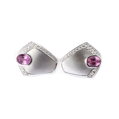 Lot 1310 - A pair of white gold pink sapphire and diamond clip earrings, by Binder-Moerisch
