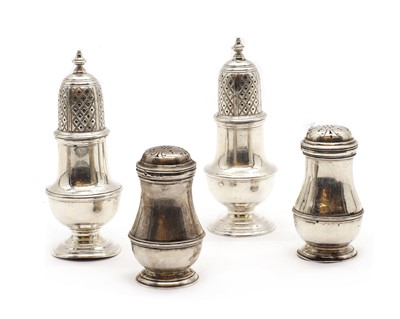Lot 32 - A pair of silver pepperettes