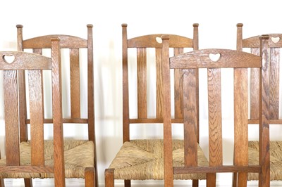 Lot 23 - A set of six rush seat chairs and an armchair