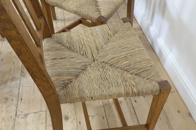 Lot 23 - A set of six rush seat chairs and an armchair