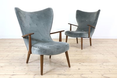 Lot 255 - A pair of upholstered wingback armchairs