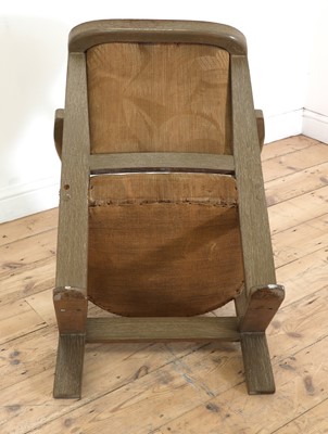 Lot 162 - A limed oak armchair
