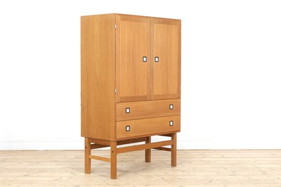 Lot 337 - A Danish light oak veneered cabinet