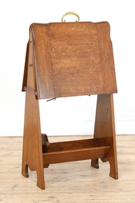 Lot 25 - An oak folio stand, book trough and pipe drawer