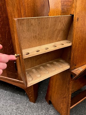 Lot 25 - An oak folio stand, book trough and pipe drawer