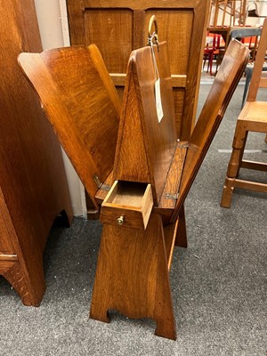 Lot 25 - An oak folio stand, book trough and pipe drawer