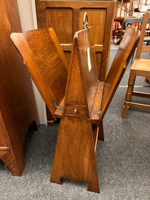 Lot 25 - An oak folio stand, book trough and pipe drawer