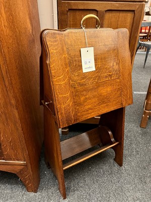 Lot 25 - An oak folio stand, book trough and pipe drawer