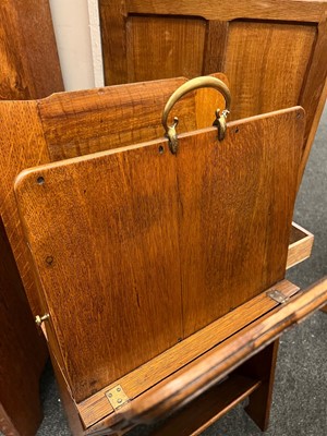 Lot 25 - An oak folio stand, book trough and pipe drawer