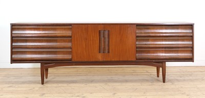 Lot 488 - A teak and walnut sideboard