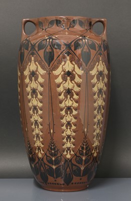 Lot 78 - A glazed earthenware two-handled vase